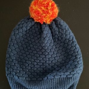 Verloop Blue knit hat with orange pom pom